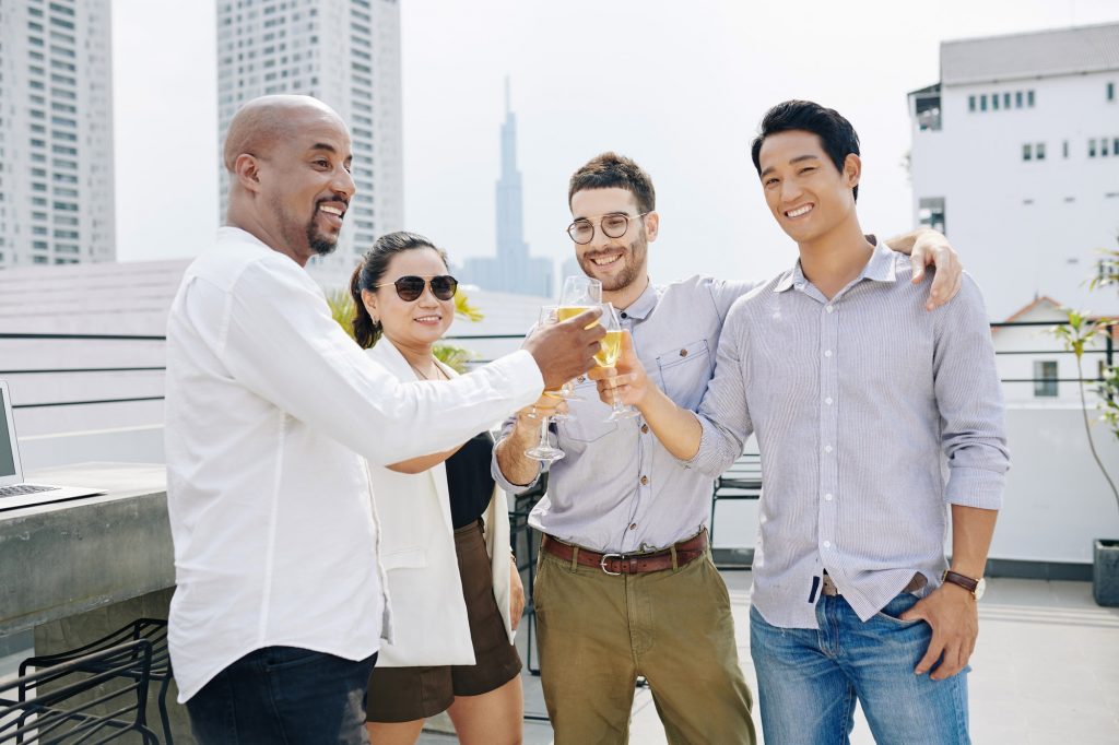 Business people attending rooftop at party